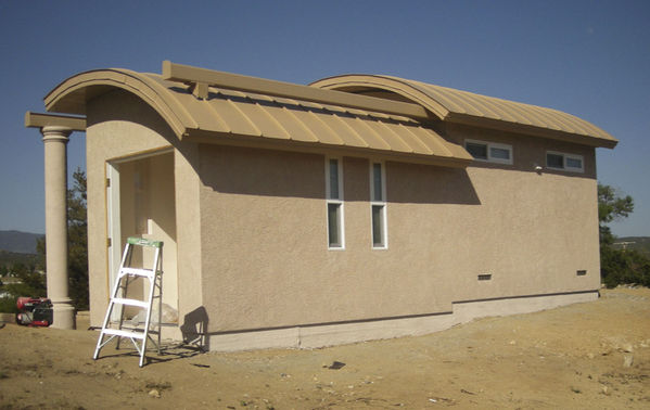 Stucco Complete View to East
This view to the east shows the contrast of color between the walls and the roof.
