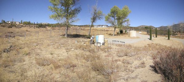 Observatory Site to the Northwest
The fence is the north/south line.  Note two 5,000 gallon water tanks for fire protection.
